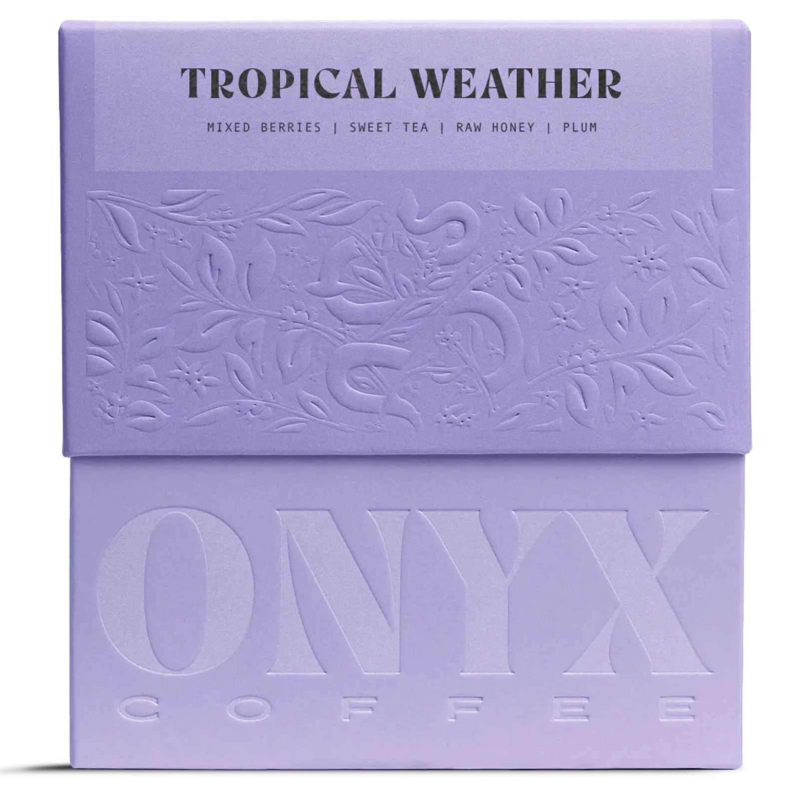 Onyx Coffee Lab “Tropical Weather” bean box in lavender with embossed botanical artwork.